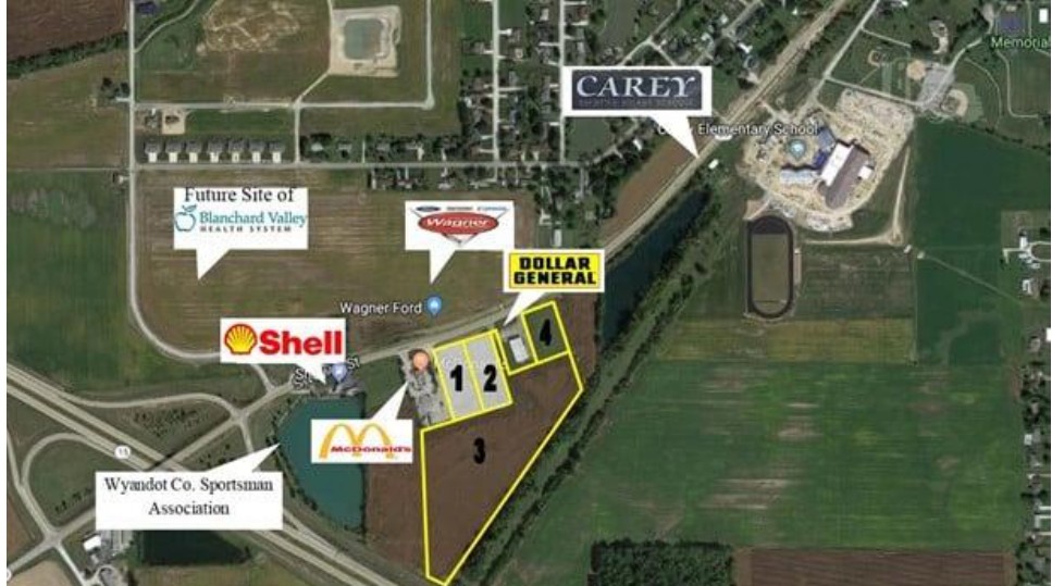 Aerial map showing commercial development sites including Shell gas station, Dollar General, and Wyandot Speedway Association locations.