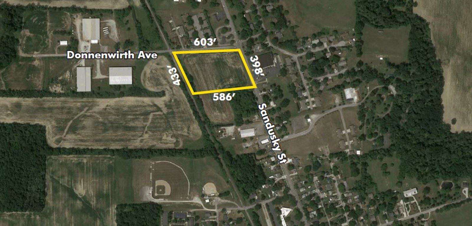 Aerial map showing a rectangular property outlined in yellow between Donnenwirth Ave and Sycamore St.