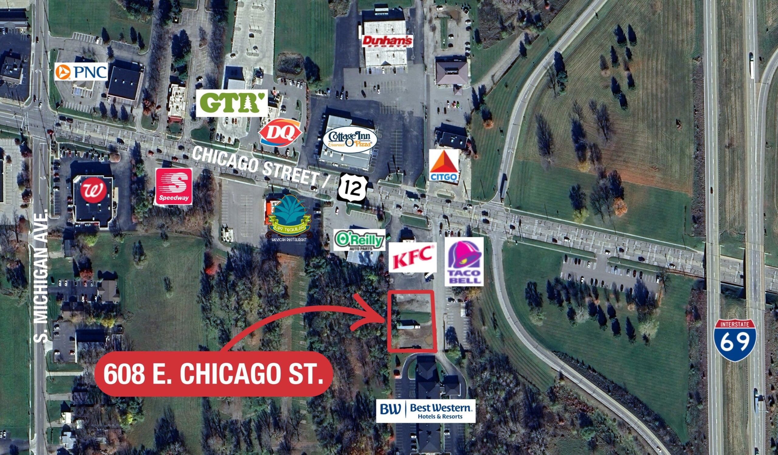 Aerial view of 608 E. Chicago St. commercial property with surrounding businesses and highway 69 nearby.